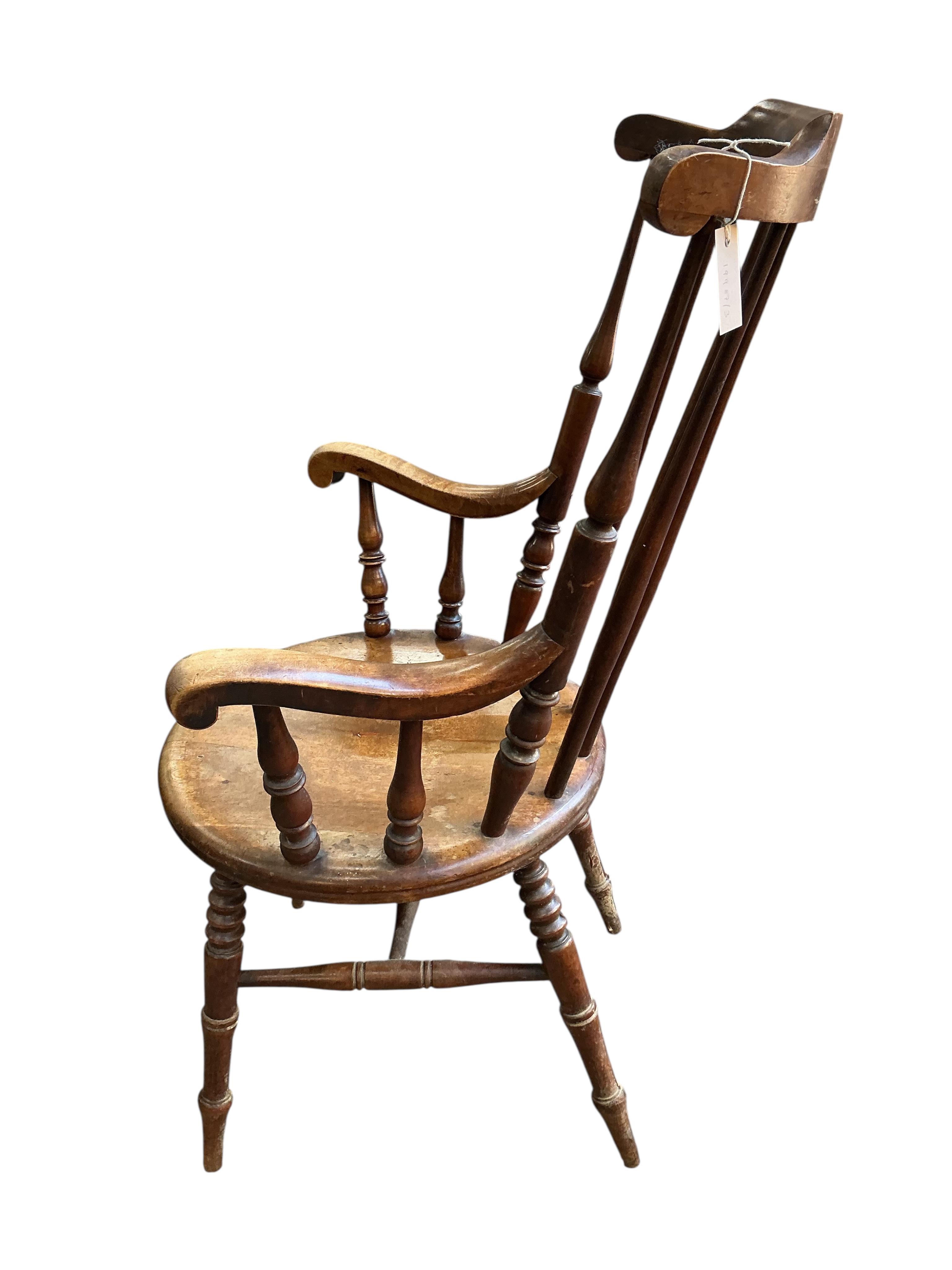 An early 20th century Windsor beech armchair, width 61cm, depth 52cm, height 110cm